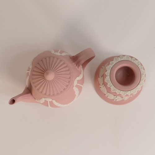 1393 - Wegdwood, eight pink Jasperware items including miniature tea pot, trinket pots, candlestick and dis... 