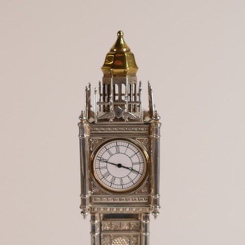 1419 - Mappin & Webb, London 2008. An Elizabeth II Silver desk timepiece modelled as Big Ben, the Palace of... 