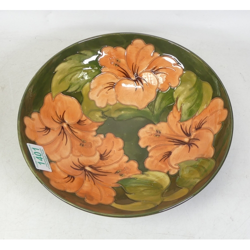 140 - Moorcroft, Hibiscus Pattern Shallow Bowl on Green Ground. Queen Mary sticker to base. Diameter: 26cm