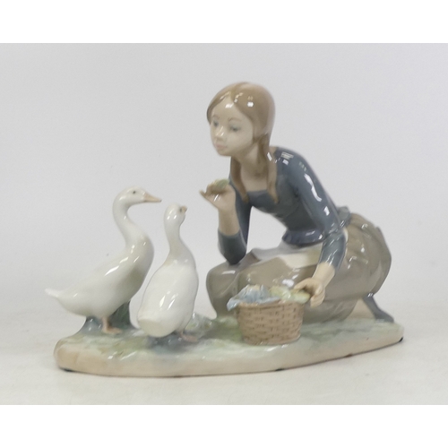 117 - Lladro figure 'Food for Ducks' 4849. (H: 18cm)