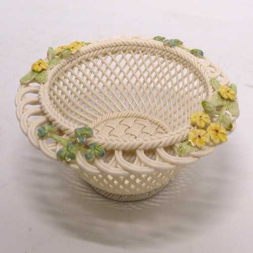 251 - A Belleek lattice-work 'Spring Basket', 16.5cm diameter, encrusted with buttercup and clover decorat... 