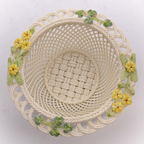 251 - A Belleek lattice-work 'Spring Basket', 16.5cm diameter, encrusted with buttercup and clover decorat... 