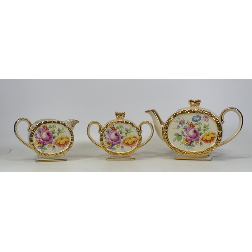 182 - Sadler, Tea for One set in a bow shape with gilt and floral design (3)