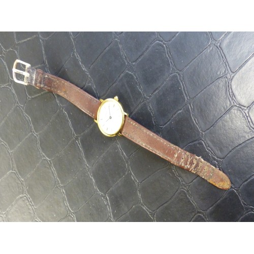 766 - Tissot gold plated wrist watch on a brown leather strap, SKK-JA-12829.