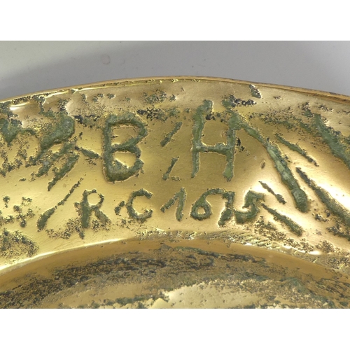 204 - A large Antique brass bowl with the markings B/H R.C 1615. (D: 33cm)