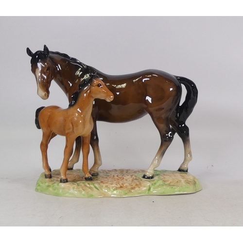 176 - Beswick mare and foal on a ceramic grass base, model no. 953.