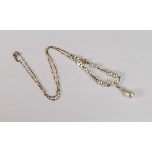 713 - 9ct gold pearl set pendant and chain, 4.1g.