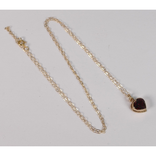 718 - 9ct gold heart shaped pendant set with brown stone and 9ct gold chain, 1.1g.