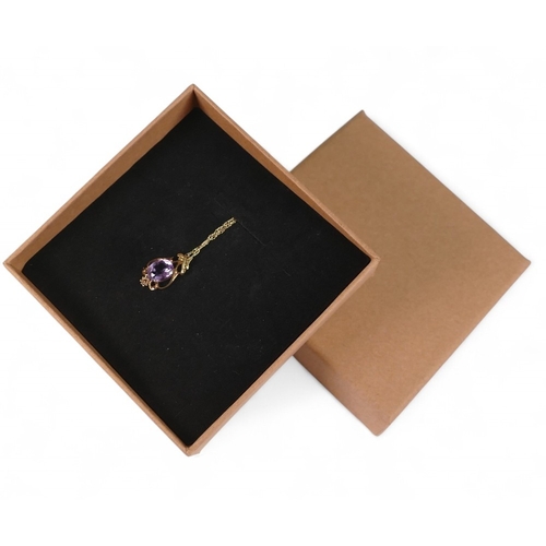 712 - 9ct gold amethyst pendant and chain, 1.8g.
