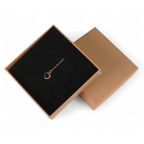 718 - 9ct gold heart shaped pendant set with brown stone and 9ct gold chain, 1.1g.