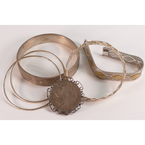 741 - A collection of Silver bangles, bracelet and 1849 French 5 franc coin made into a brooch, 122.5g.