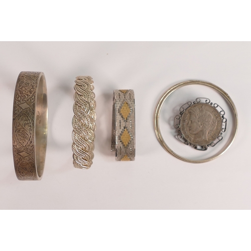 741 - A collection of Silver bangles, bracelet and 1849 French 5 franc coin made into a brooch, 122.5g.