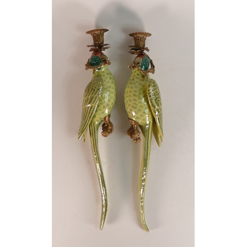 38 - A pair of ornate porcelain parrot wall sconce with metal bronze effect candlestick mounts. 48cm tall... 