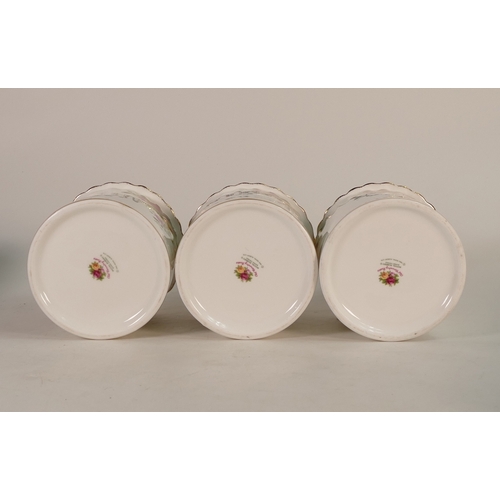 142 - Royal Albert 'Old Country Roses' set of three lidded storage jars. Height:- 20cm including lids (3)