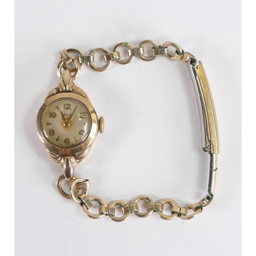 879 - Ladies 9ct gold wrist watch with gold plated bracelet.