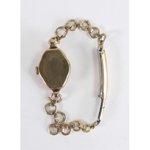 879 - Ladies 9ct gold wrist watch with gold plated bracelet.