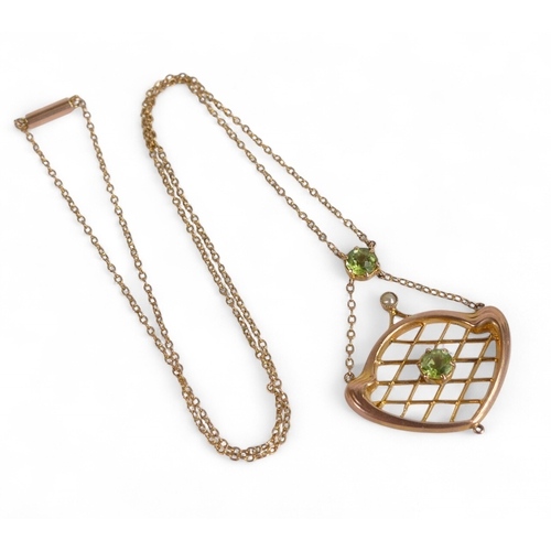 863 - 9ct rose gold pendant and chain, the pendant set with green stones 3.2g.