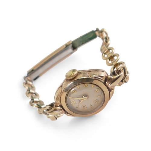 879 - Ladies 9ct gold wrist watch with gold plated bracelet.
