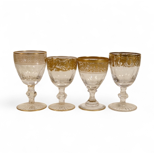 488 - De Lamerie Fine Bone China Glass Goblets, heavily gilded with various designs, Made in England. (4)
