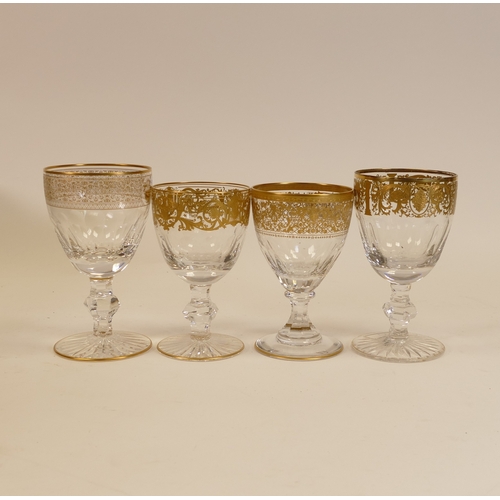 488 - De Lamerie Fine Bone China Glass Goblets, heavily gilded with various designs, Made in England. (4)