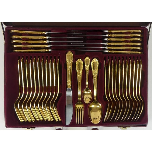 545 - Solingen made in Germany, Seventy Piece 23/24 karat hard gold plated cutlery set complete with leath... 