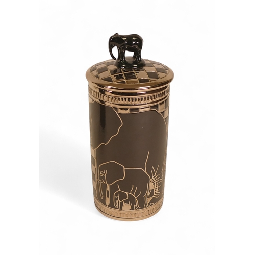 330 - Dennis China Works Lustre Lidded Pot 'Elephants' on black ground, elephant figured handle. 2010, des... 