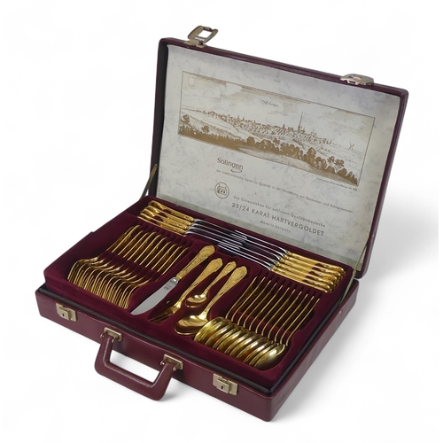 545 - Solingen made in Germany, Seventy Piece 23/24 karat hard gold plated cutlery set complete with leath... 