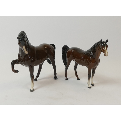 109 - Beswick, Head Tucked Leg up, 1549, together with Arab Xayal, 1265. (2)