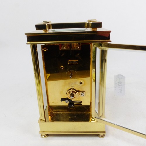A David Peterson brass carriage clock, circa 1990, retailed by JJ ...