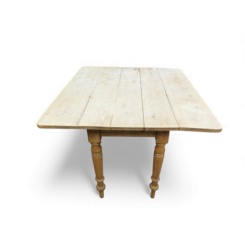 655 - Pine farmhouse drop leaf plank top kitchen table with turned legs. H74cm x W106cm