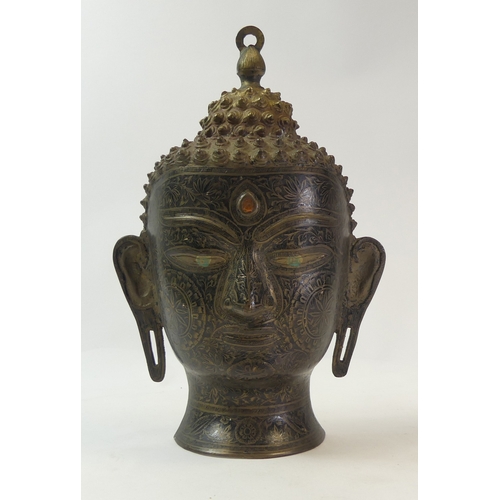 289 - A bronze or brass Southeast Asian style Buddha head with etched designs. (H: 35cm)