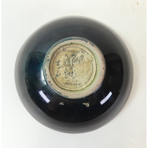 133 - Moorcroft Flambe 'Columbine' small footed Bowl, designed by Walter Moorcroft. 10cm dia