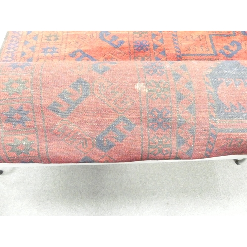 654 - Vintage Afghan tribal wool rug with a deep red field and navy blue accents, featuring a repeating oc... 