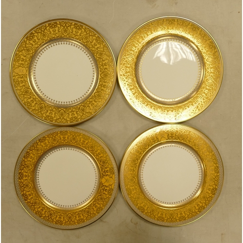 585 - De Lamerie Fine Bone China, heavily gilt plates with yellow banding. Made in England (4)