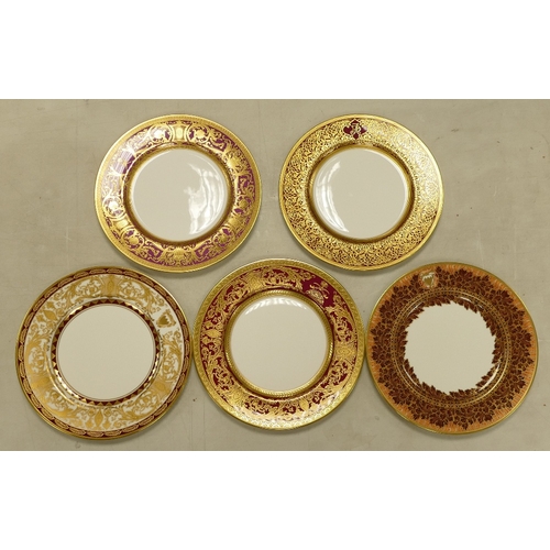 522 - De Lamerie Fine Bone China, a selection of heavily gilt plates in varied colourways & designs. Made ... 