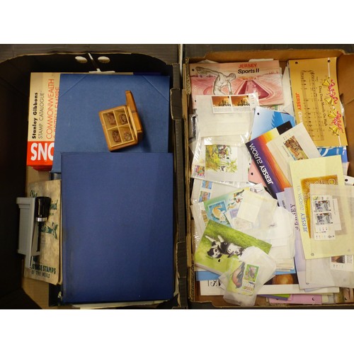 465 - A collection of stamp albums, loose stamps, stamp sets and FDCs, together with a small wooden stamp ... 