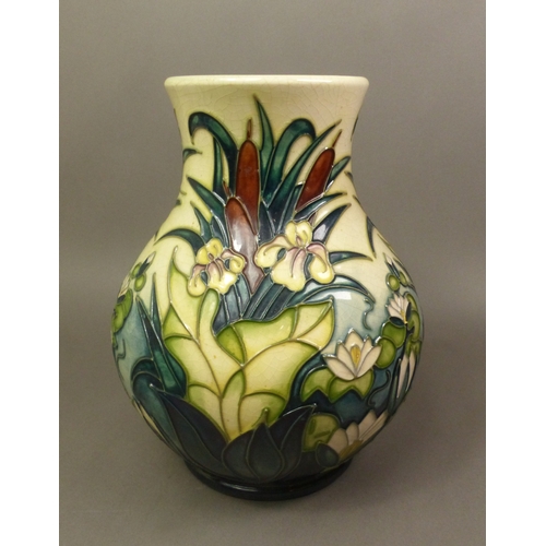 129 - Moorcroft baluster vase in the Lamia design, height 24cm.