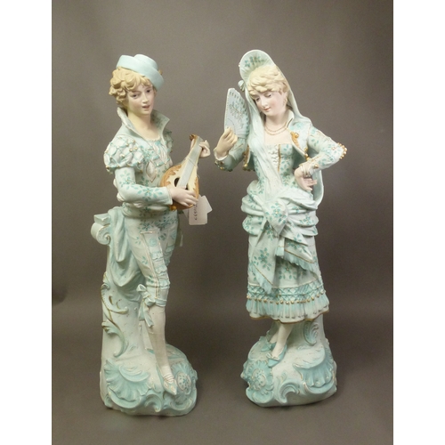 80 - Two large Continental figures depicting a male musician and a female dancer, height 49cm (2).