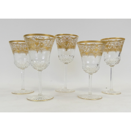601 - De Lamerie Fine Bone China Wine Glasses heavily gilded with various designs. Made in England. (5)