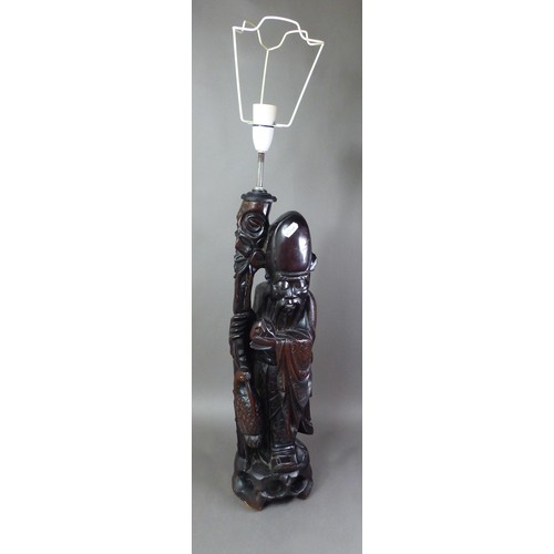 280 - Large carved hardwood Oriental figural table lamp, height of wood base 55cm (no wiring).