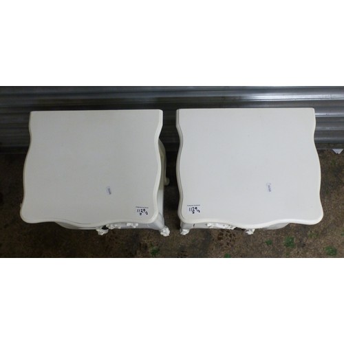 676 - A pair of modern, painted white 2-drawer bedside tables, with lower tier shelf to each, swag and bow... 