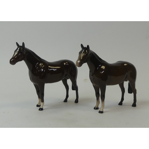 110 - Royal Doulton bay thoroughbred stallions (small chip to left ear). (2)