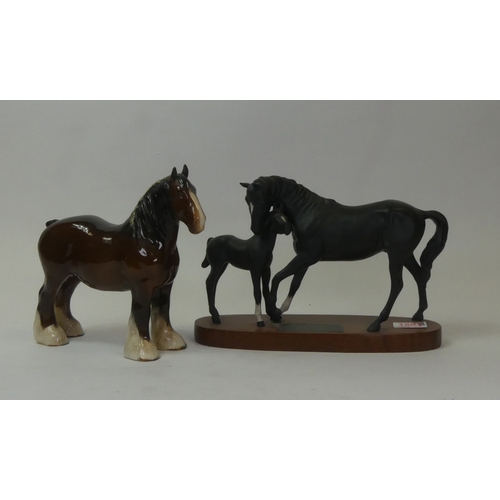 107 - Beswick, Connoisseur Black Beauty and Foal on wooden plinth, together with Shire, 818. (2)