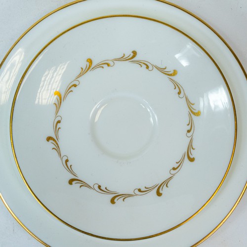372 - Royal Doulton 'Rondo', gilt design on crisp white China, part tea/dinner set to include:- tea pot, e... 