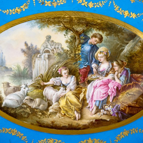 36 - A large oval dish ornately decorated in the manner of Sevres porcelain, featuring a male and three f... 