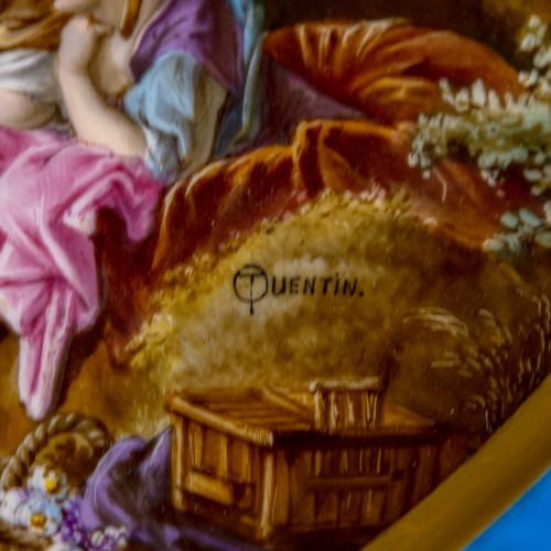 36 - A large oval dish ornately decorated in the manner of Sevres porcelain, featuring a male and three f... 