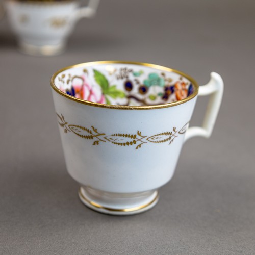 57 - A collection of 19th century porcelain tea cups in various patterns from different manufacturers, de... 