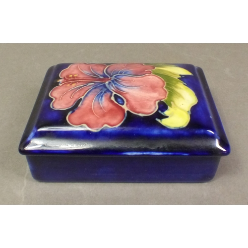Moorcroft Hibiscus pattern rectangular box and cover, together with a ...