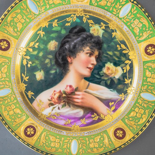 A Royal Vienna plate with a green and gilt border, with centre ...