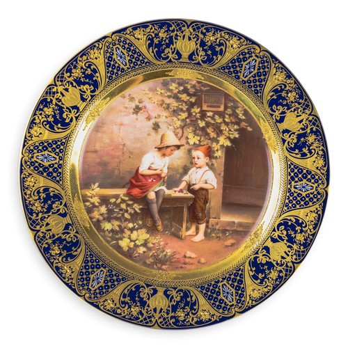 A Royal Vienna plate with a cobalt blue and gilt border, with centre ...